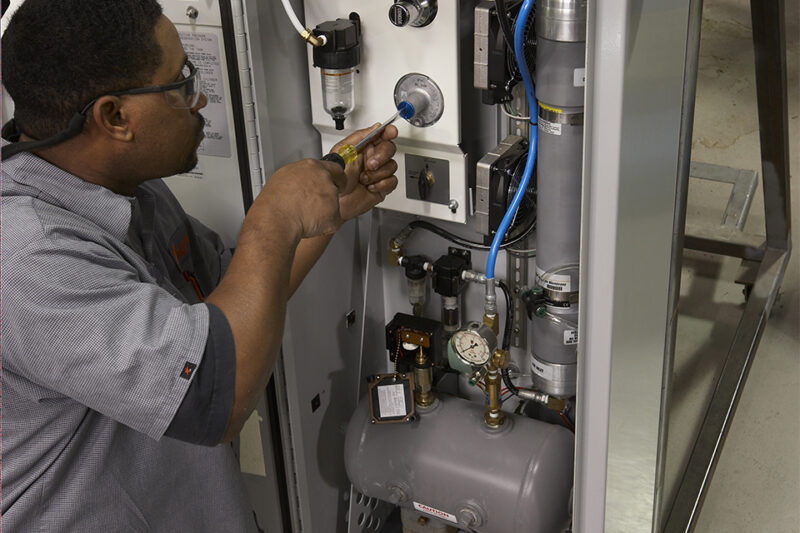 Man working on inside of THP Nitrogen Generator
